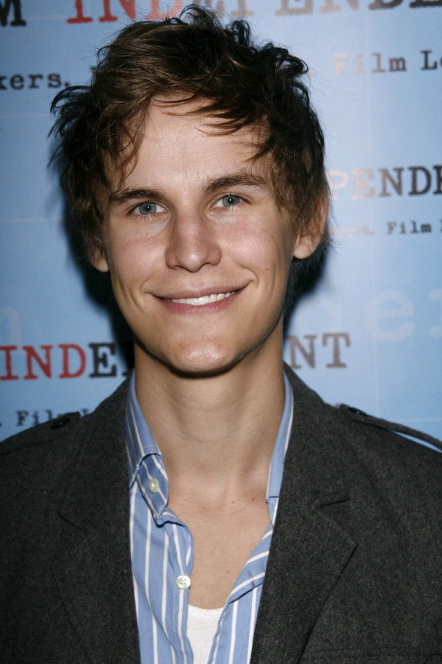Smiling man blue background carpet free wallpaper - medium preview image
