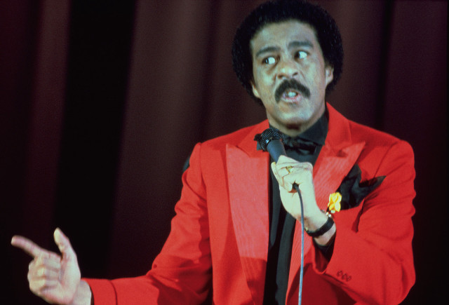 Man red suit microphone pointing free wallpaper - medium preview image