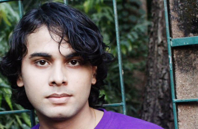 Man purple shirt green fence free wallpaper - medium preview image