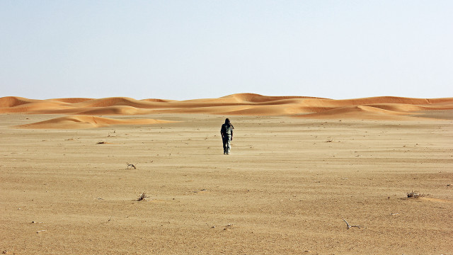 Person desert sand dunes clear free wallpaper - medium preview image