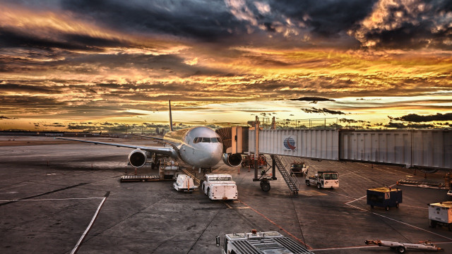 Plane parked tarmac airport sunset #2 free wallpaper - medium preview image