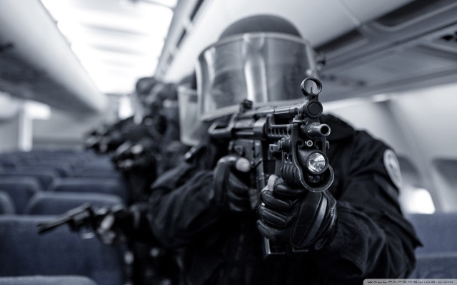 Man gun helmet plane passengers free wallpaper - medium preview image