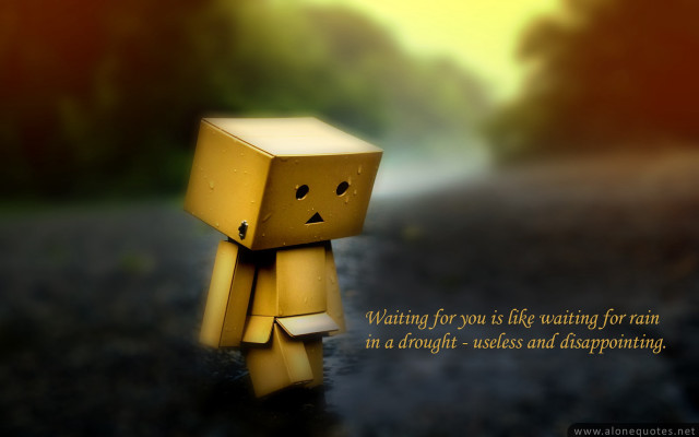 Small yellow toy sad face free wallpaper - medium preview image