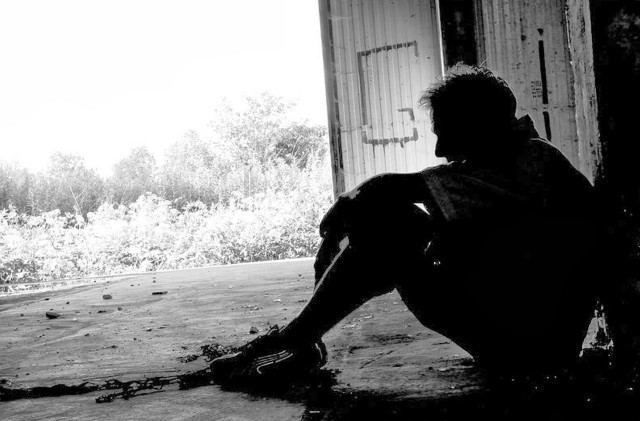 Man sitting ground building door free wallpaper - medium preview image