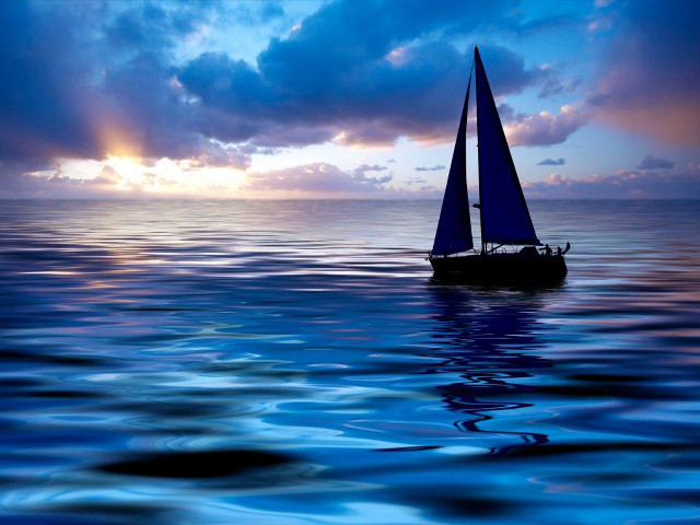 Sailboat ocean sunset dawn clouds free wallpaper - medium preview image