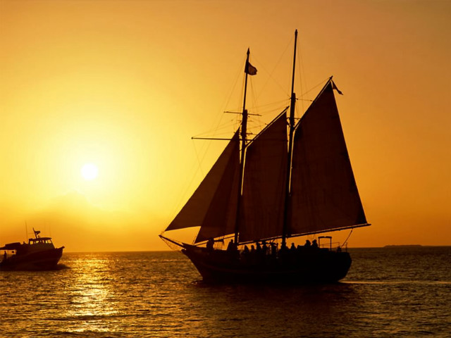 Sailboat ocean sunset foreground background free wallpaper - medium preview image
