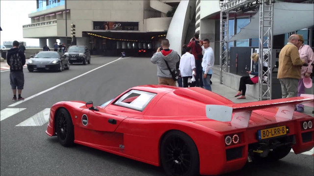 Red race car parked road free wallpaper - medium preview image