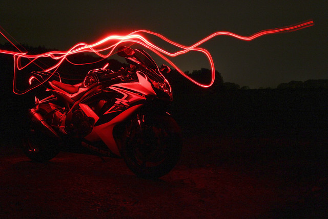 Motorcycle red light dark blurry free wallpaper - medium preview image