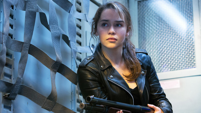 Woman holding gun serious look #2 free wallpaper - medium preview image
