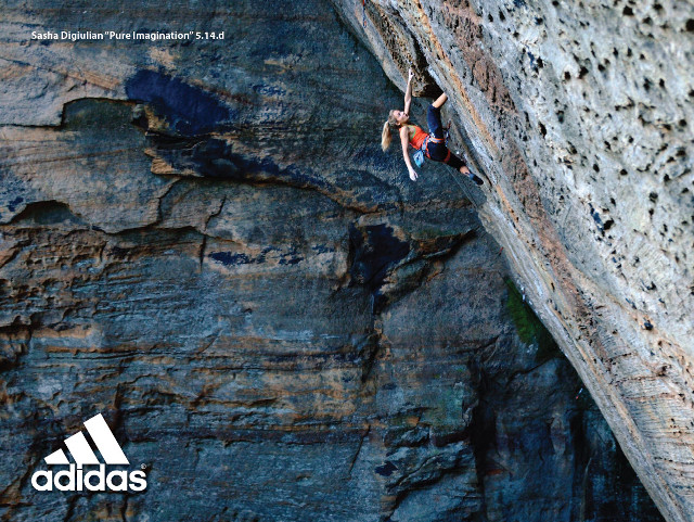 Man climbing rock face helmet #2 free wallpaper - medium preview image