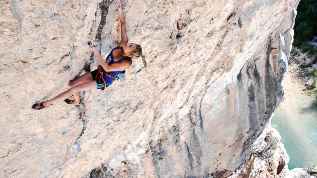 Woman climbing cliff rope helmet #2 free wallpaper - medium preview image