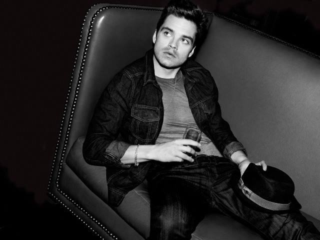 Man couch hat lap black free wallpaper - medium preview image