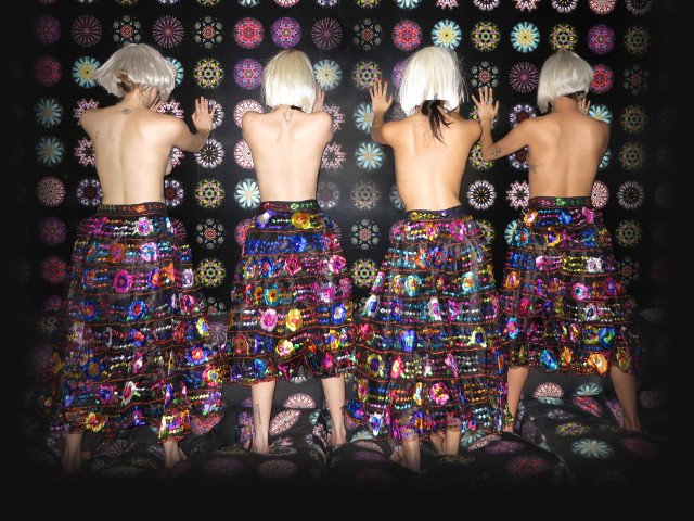 Mannequins colorful skirt black background free wallpaper - medium preview image