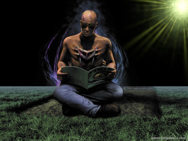 Man sitting ground reading book free wallpaper - medium preview image