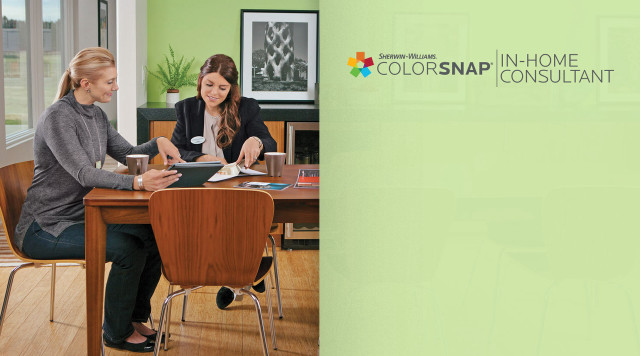 Two women sitting table green free wallpaper - medium preview image