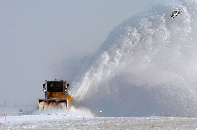 Snow blower spraying snow field free wallpaper - medium preview image