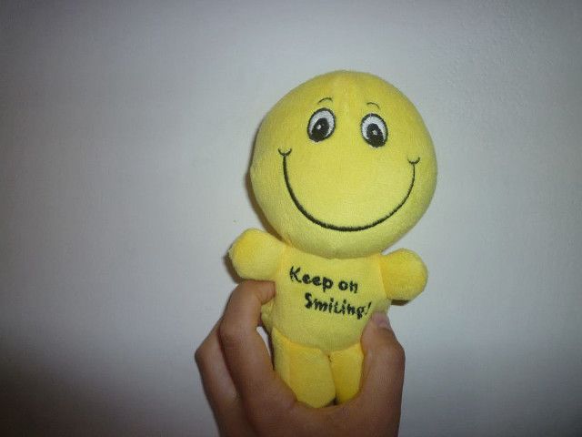 Yellow stuffed smiley face keep free wallpaper - medium preview image