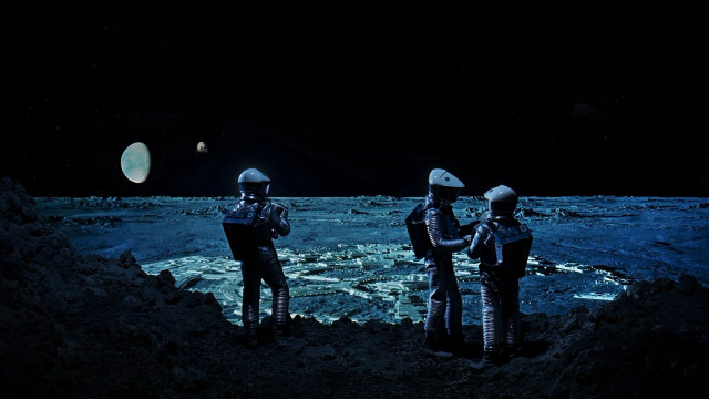 Astronauts moon surface distant object free wallpaper - medium preview image