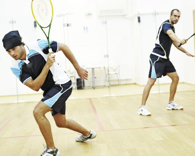 Man holding tennis racquet gym free wallpaper - medium preview image