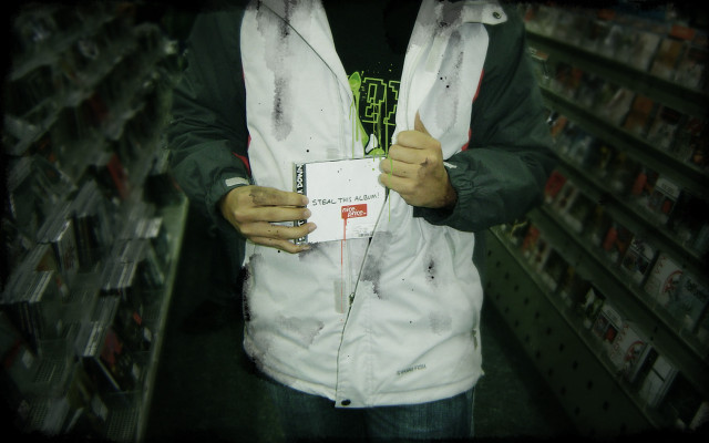 Man holding package store aisle free wallpaper - medium preview image