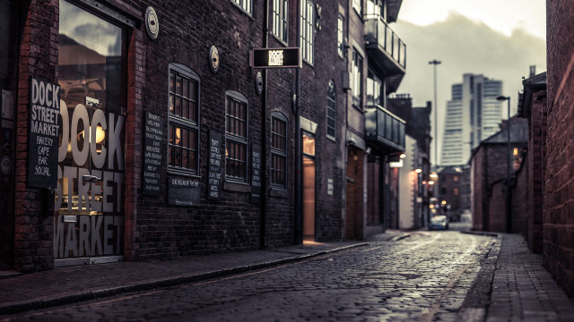 Narrow street brick building clock #2 free wallpaper - medium preview image
