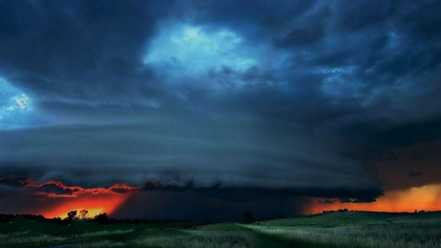 Storm cloud sunset grassy field free wallpaper - medium preview image