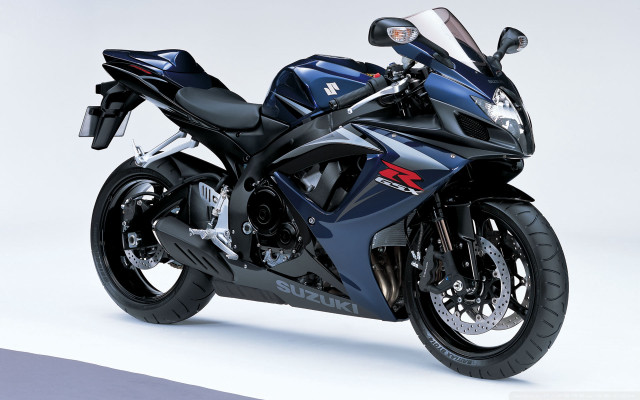 Blue motorcycle parked white surface free wallpaper - medium preview image