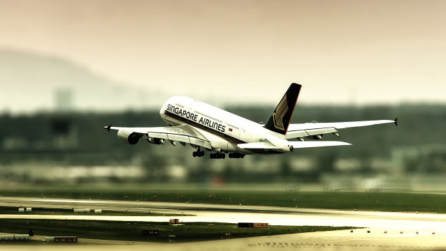 Large passenger jet flying runway #2 free wallpaper - medium preview image