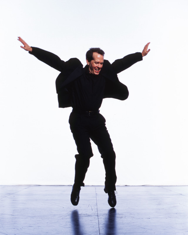 Man jumping black suit outstretched free wallpaper - medium preview image