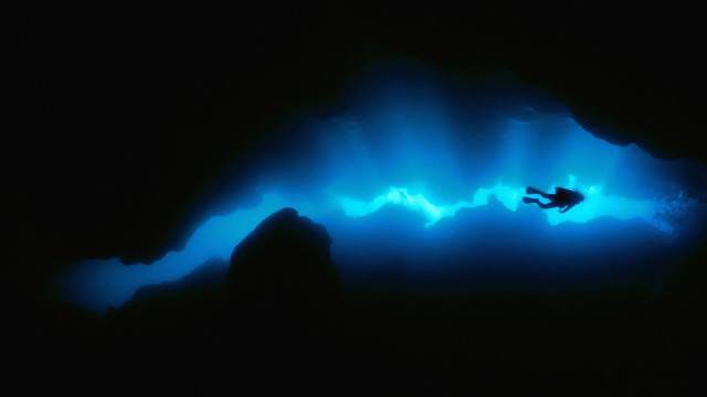 Swimming cave blue light man #2 free wallpaper - medium preview image