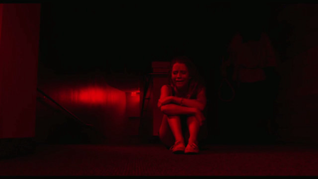 Woman sitting dark room red free wallpaper for desktop - medium preview image