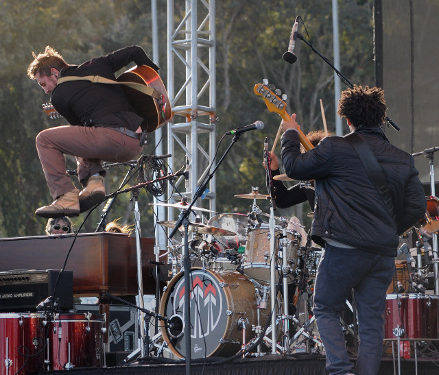 Man jumping guitar stage performance free wallpaper - medium preview image