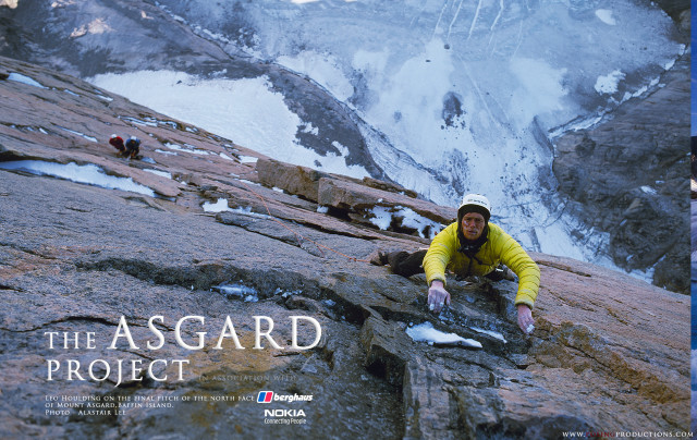 Man climbing mountain yellow jacket free wallpaper - medium preview image