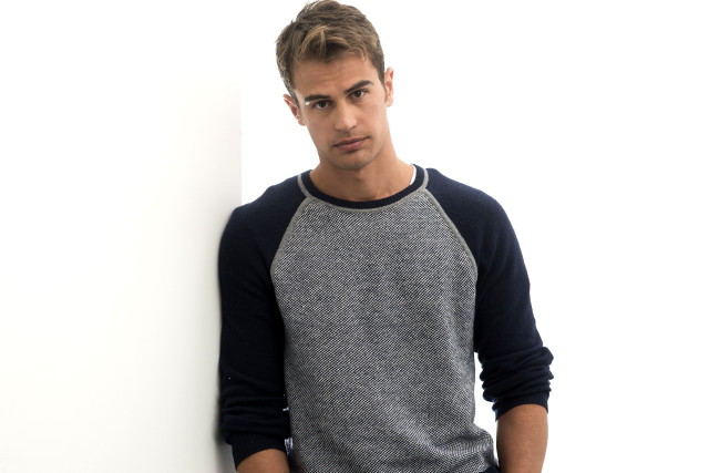 Man leaning against wall serious free wallpaper - medium preview image