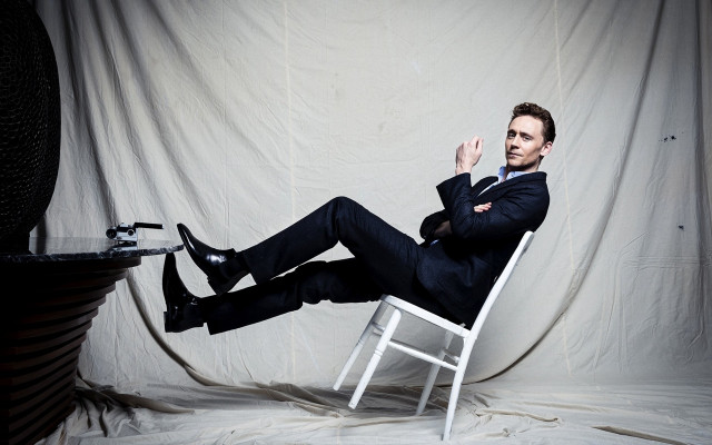 Man suit sitting chair legs free wallpaper - medium preview image
