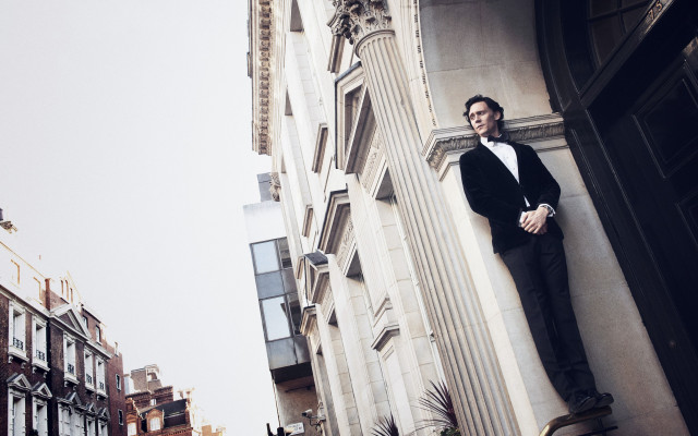 Man leaning building arms crossed free wallpaper - medium preview image