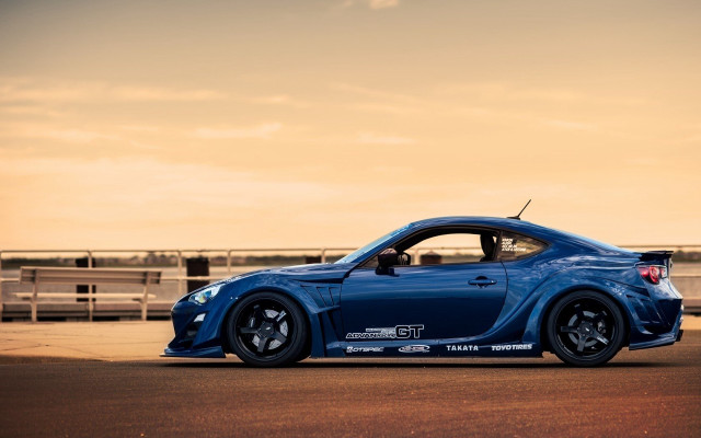 Blue sports car road fence #3 free wallpaper - medium preview image
