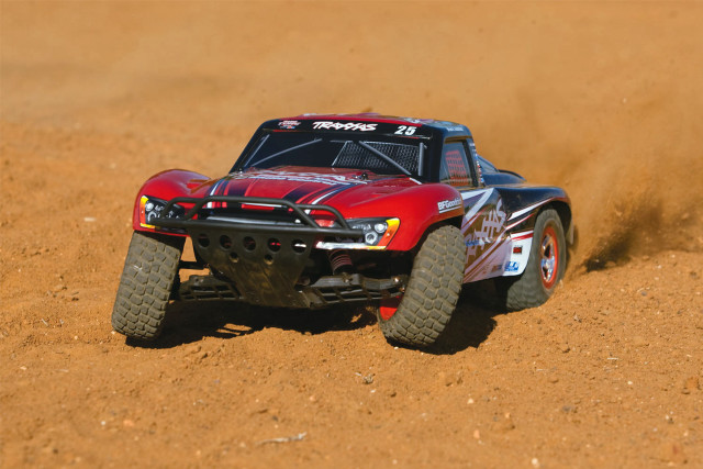 Red truck driving desert dust free wallpaper - medium preview image