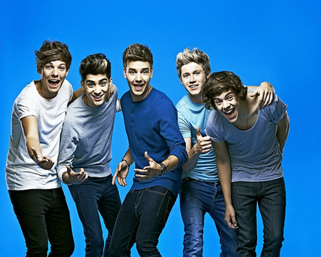 Young men pointing blue background free wallpaper - medium preview image