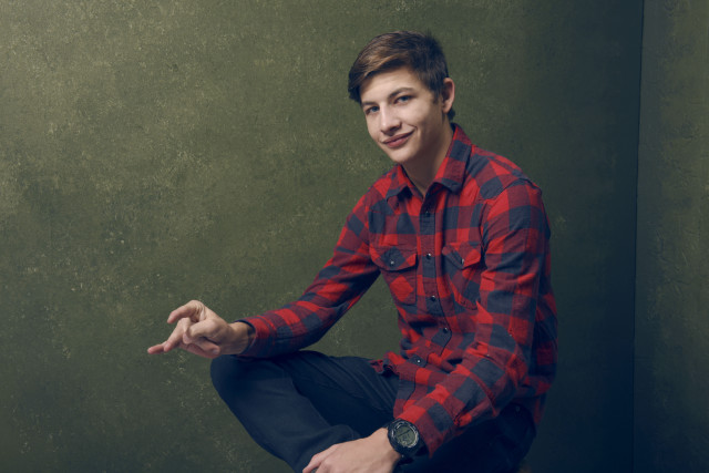 Young man toilet green wall free wallpaper - medium preview image
