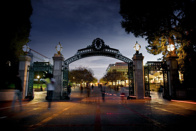 People walking metal arch nighttime free wallpaper - medium preview image