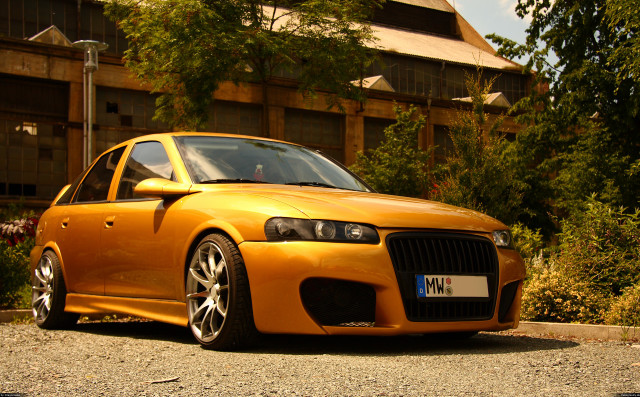 Yellow car parked building clock free wallpaper - medium preview image