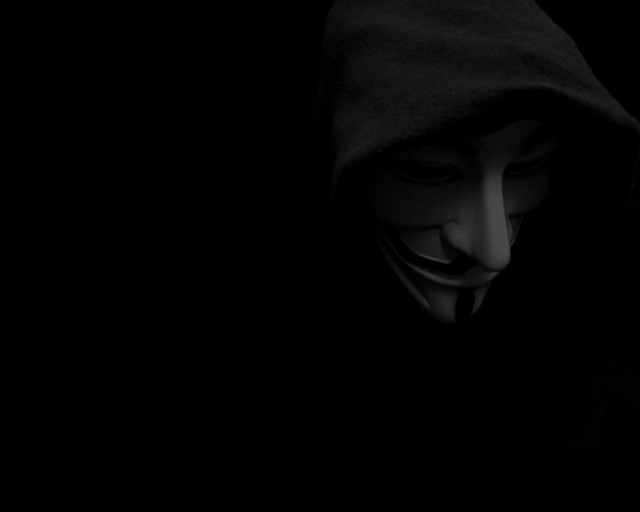 Masked hooded person dark cellphone free wallpaper - medium preview image
