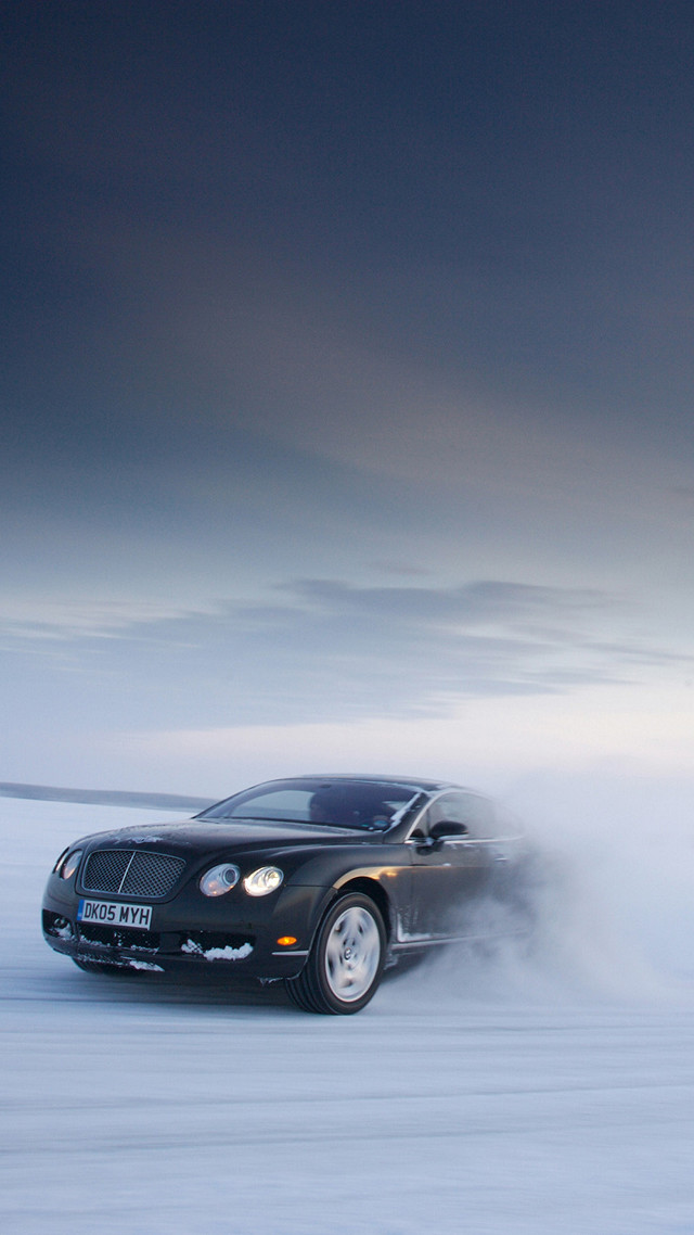 Black car snow field sky free wallpaper - medium preview image