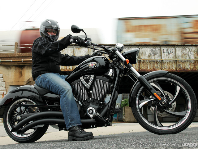 Man motorcycle street bridge train free wallpaper - medium preview image