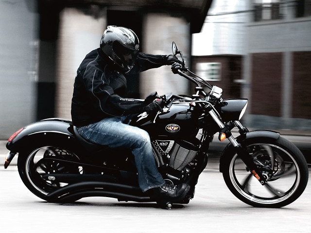 Man riding motorcycle street building free wallpaper - medium preview image