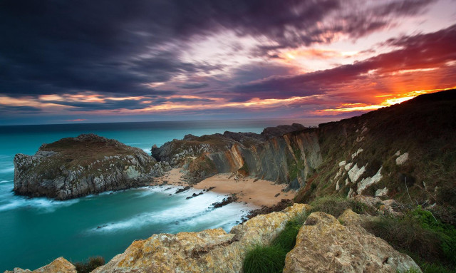Sunset rocky beach water cliff free wallpaper - medium preview image