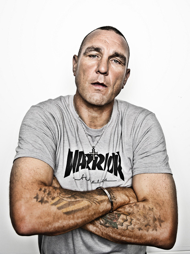 Tattooed man posing arms crossed free wallpaper - medium preview image