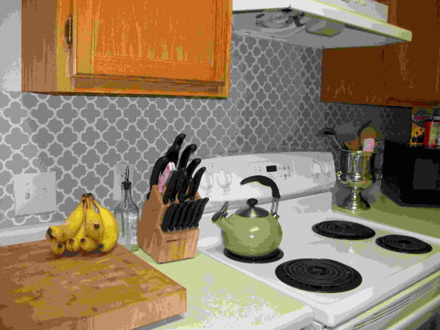 Kitchen stove cuttingboard knives bananas free wallpaper - medium preview image