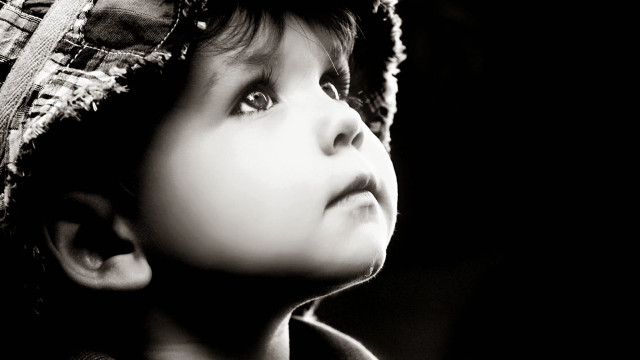 Young boy hat looking up free wallpaper - medium preview image
